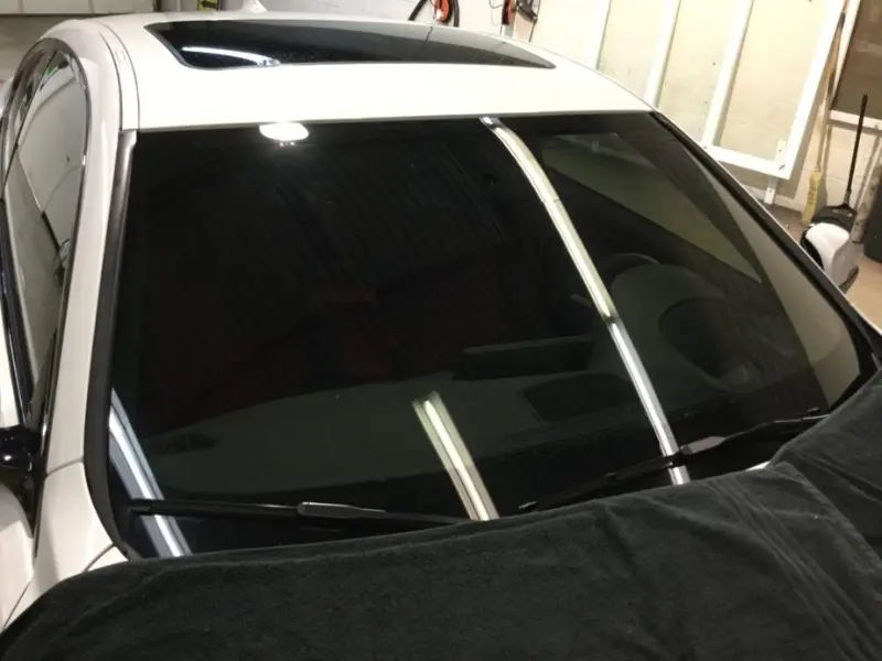 Ceramic heat-rejection film on a windshield